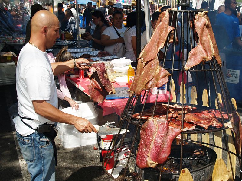 800px-Hanging_Meat_at_a_Street_Fair_2